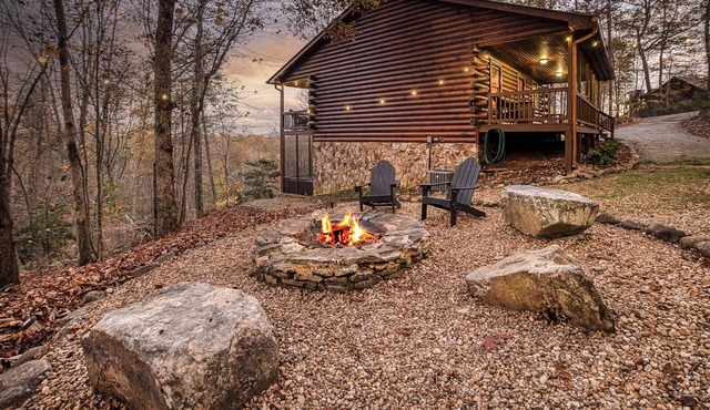 Dog-friendly log cabin with Mountain views, hot tub & game room — near downtown