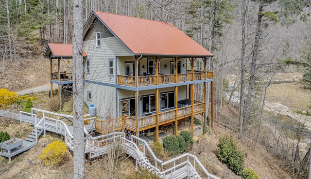 Dog-friendly, waterfront home with hot tub, two kitchens, AC, fireplace, & W/D