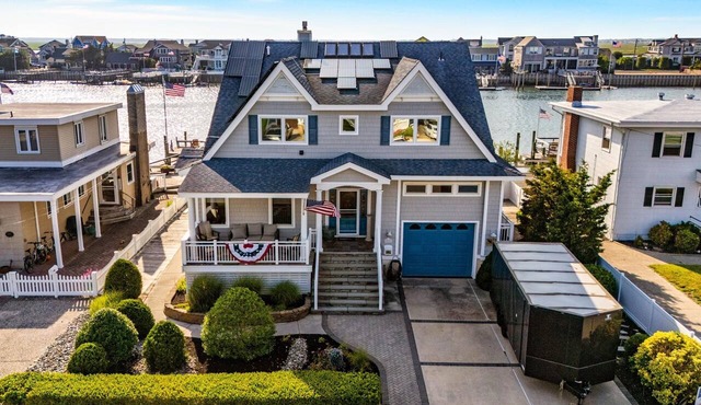 Experience the rare charm of a bayfront retreat with timeless character—far from the ordinary beach house.