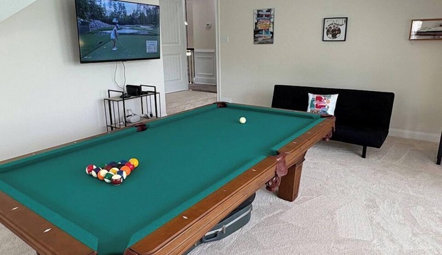 Four Bedroom Master's Rental with Pool Table and Screened-In Porch.