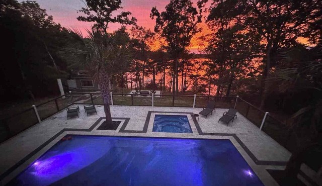 Impeccable Lakefront Oasis with Pool, Hot Tub, Dock, Gameroom, Firepit & Sun Set