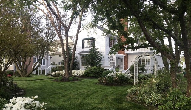Large private property with beautiul gardens across the street from the beach