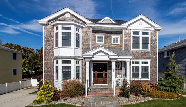 Located just 1 ½ blocks to the beach, this distinctive property boasts seven (7) bedrooms, each with their own custom, private bath, as well as one powder room and an exquisite, solid mahogany, outdoor shower