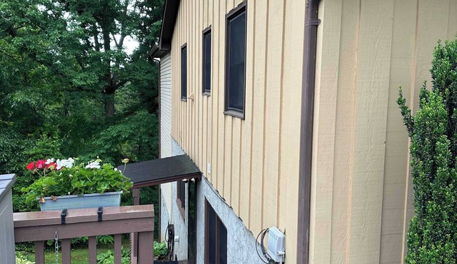 Lower-level lake retreat with mountain views, pool, central AC, deck, grill