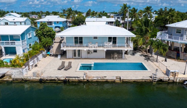 Open Water Views, NEW Pool, Elevator & Easy Boating from Modern Canal Home