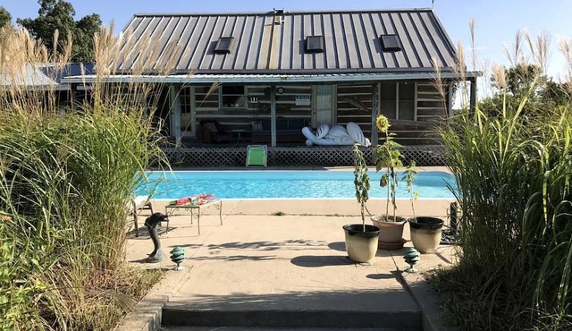 Pet-Friendly Log Cabin with an Outdoor Pool near Crofton, Kentucky in Crofton