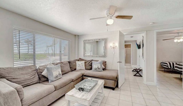 Serene oceanfront suite with Gulf view, grill, patio, central AC, & WD