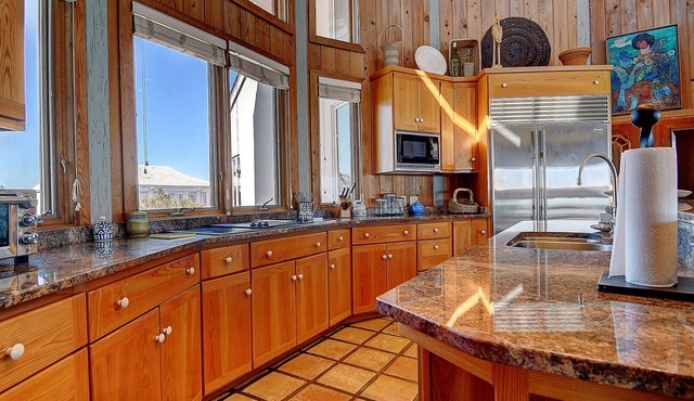 Surprise awaits as you enter this exquisite front row beach home