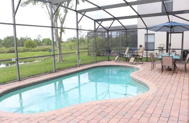 4 bedroom 3 bathroom pool home with water view at small gated community of High Grove Resort