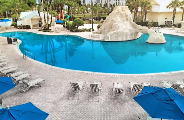 Experience Theme Park Magic in our Homey Orlando Studio - Pool and BBQ