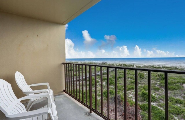 Oceanfront 2BR/2BA condo with pool, balcony, and beach access.