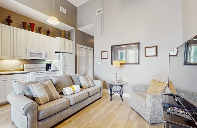 Spacious condo w/large living area, private balcony & shared pool