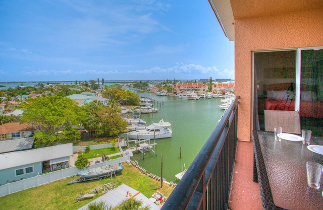 Top Floor Overlooking the Marina. Close to Johns Pass. Spacious with Two Private Balconies!