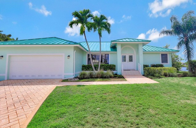 Waterfront house on key lot with unmatched water view and big heated pool