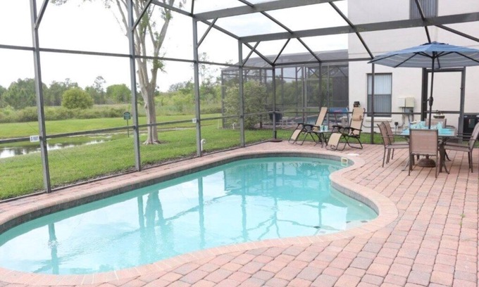 Four Corners Condo | 4 bedroom 3 bathroom pool home with water view at small gated community of High Grove Resort