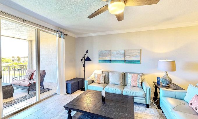 Port Canaveral Condo | Comfy condo in great location with pool, covered balcony, fast WiFi, W/D & AC