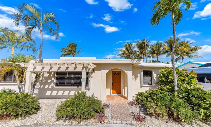 Little Venice House | Custom canal-front home with private pool, palapa hut, & outdoor kitchen