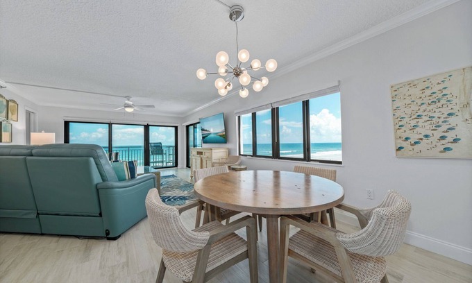 New Smyrna Beach Condo | Direct oceanfront southern corner condo with large wrap-around balcony and heated pool
