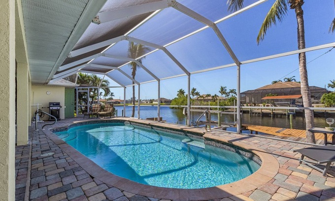 Burnt Store Villa | Fun for the Whole Family! Pool Table, Heated Pool, Fishing Dock -Villa Serendipity-Roelens Vacations