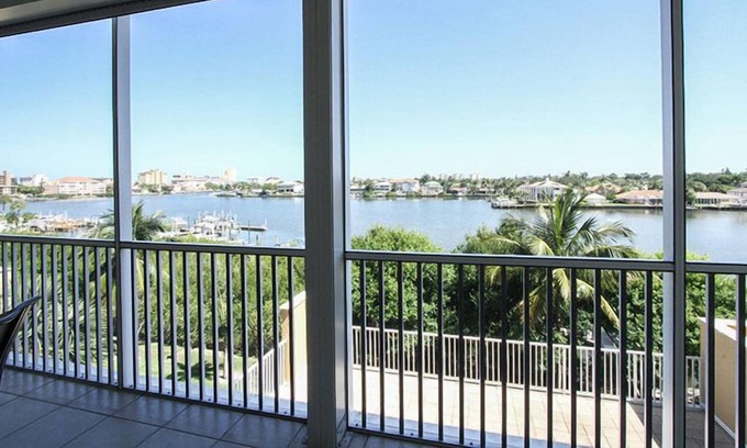Vanderbilt Beach Condo | Great location! 2 blocks from the beach. End unit with beautiful bay views...