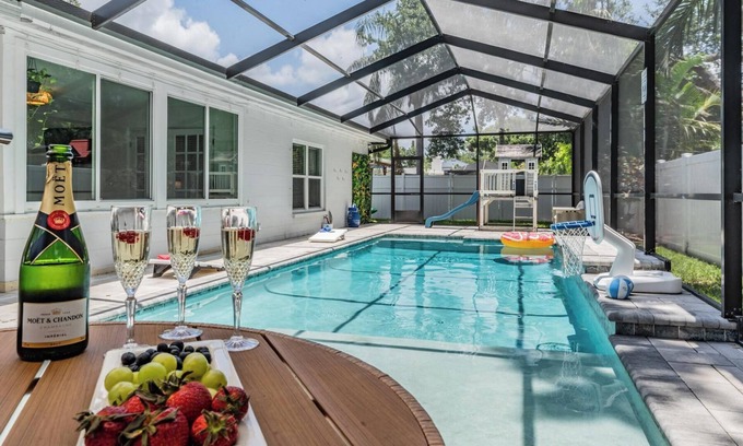 Beach Park House | Heated pool, arcade, 6 TVs, 4-bedroom house with AC, WiFi in brilliant Tampa