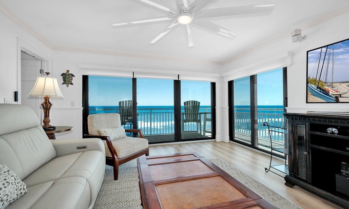 New Smyrna Beach Condo | Luxury, direct oceanfront top-floor corner with wrap-around balcony and heated pool