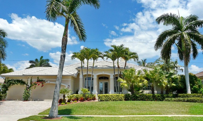 Marco Island House | Modern waterfront home with pool/view of waterways