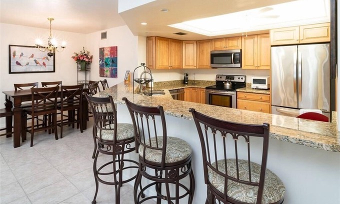 Pelican Bay Condo | Renovated Beachwalk 3 Bedroom Condo -5 minute walk to Beach!