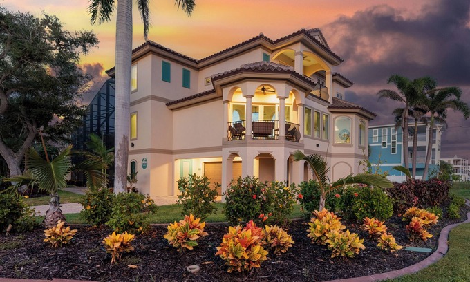 Mid Island House | Sabal Palms is a spectacular luxury pool home across from beach with Gulf view