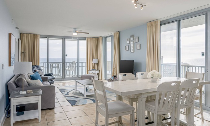 Pensacola Beach Condo | Spacious, open layout floor to ceiling with a wrap around balcony - ED1250