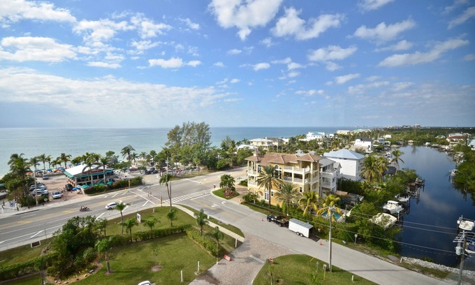 Bonita Springs Condo | Spectacular 9th Floor Views and Sunsets! Steps to the beach. Free in suite WiFi.