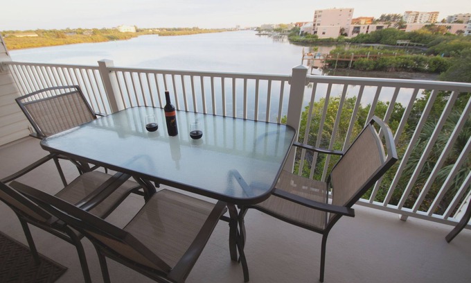 Indian Shores Condo | Sunrises and sunsets – finely appointed direct waterfront - steps from the beach