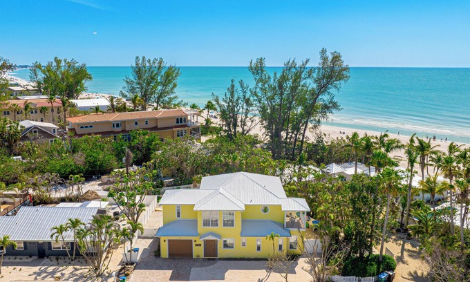 Holmes Beach House | Surfside AMI; backyard oasis steps to beach, heated pool, putting green,+gear!