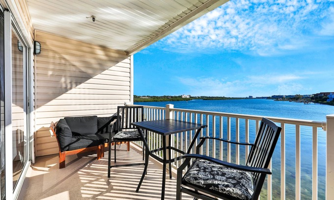 Indian Shores Condo | Waterfront condo with shared heated pool and splendid views - Dogs ok