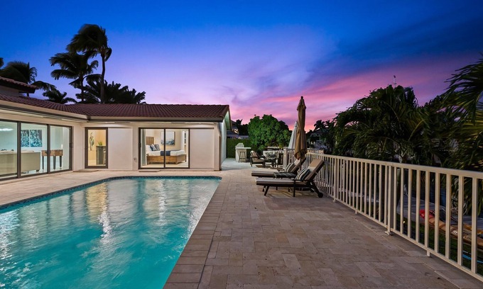 Lighthouse Point House | Waterfront~HUGE Heated Pool~Open Floor Plan~BIG Patio with Lots of Seating + Dock~Near Beaches