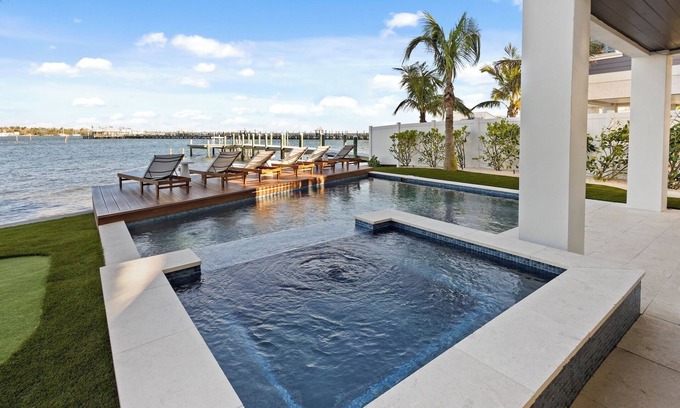 Bradenton Beach House | Waterfront Luxury Home with Pool and Spa, Golf Cart, and beach Bikes included!